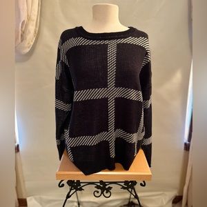 Black sweater with white stripes. Size Lg.